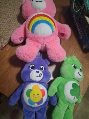 Care Bears Pink, Purple & Green Plush Set with Rainbow, Flower & Clover Badges